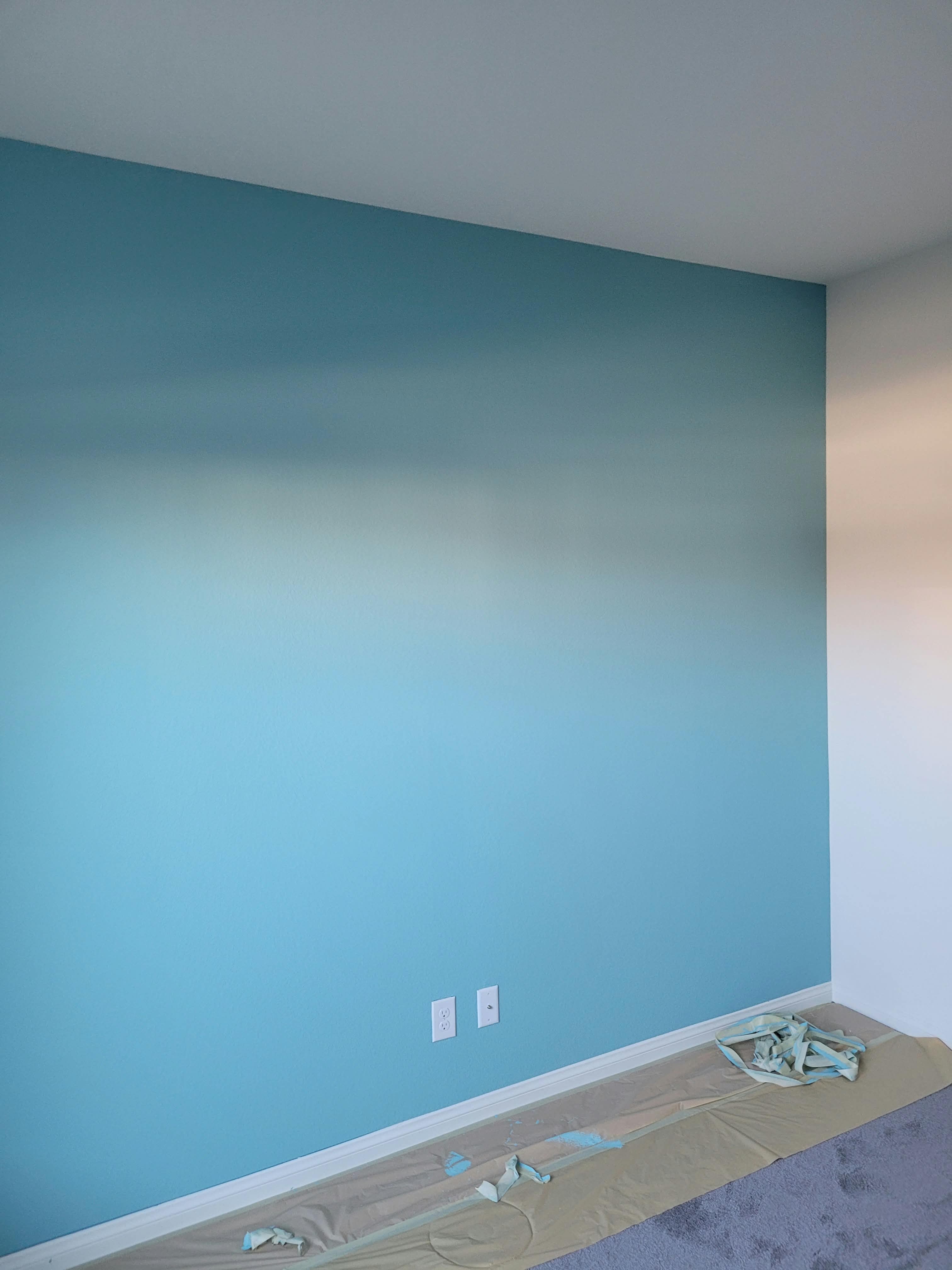 Bedroom wall professionally painted in a rich blue color